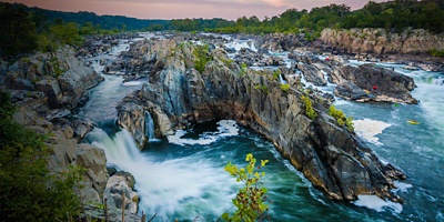 View of rapids in the Potomac River at sunset, at Great Falls Park, Virginia.