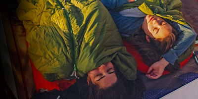 Two sisters asleep in their tent in early morning light on Horseshoe Mesa in Grand Canyon National Park, Arizona.
