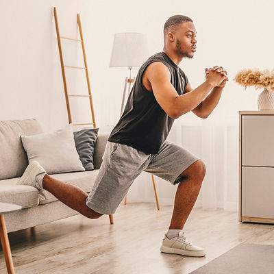 A man does Single-Leg Squats at his home