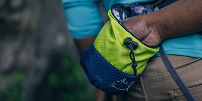 Climber reaching into their chalk bag