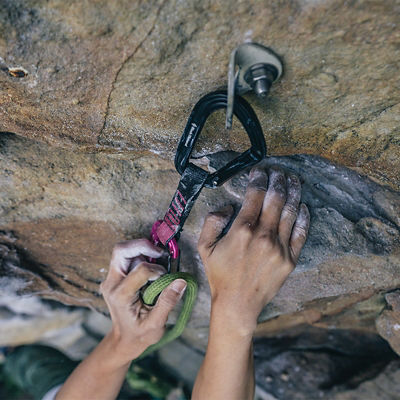 Carabiner attached to a climbing anchor