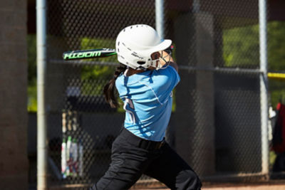 Girl swinging a softball bat