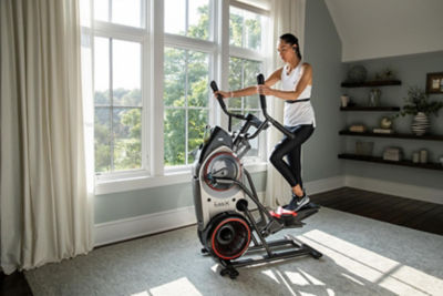 Woman on elliptical in her home