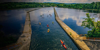 Paddlerss paddle in the Waterford Flight of Locks of the Erie Canal