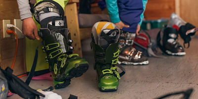 Women skier putting her ski boots at the Selkirk Lodge getting ready to head out into the backcountry of the Albert Canyon.