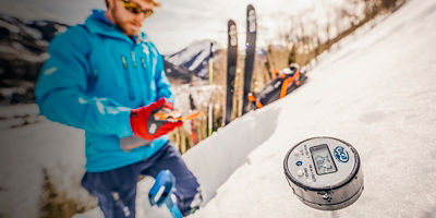 A man evaluates avalanche potential before making a ski run in the backcountry of Ouray, Colorado