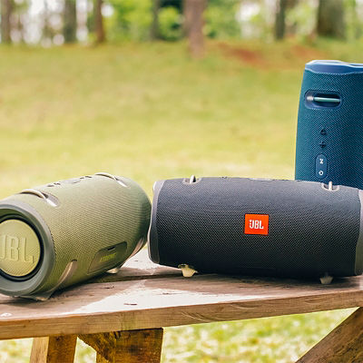 An image of 3 JBL portable speakers