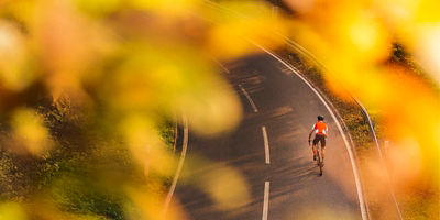 A man riding up a hill cycle training