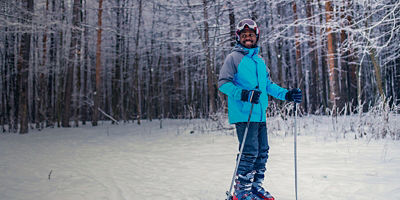 A man smiles before skiing