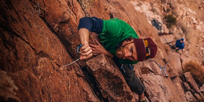 Matt Vodjansky places gear while climbing a route in Keyhole Canyon.  An often overlooked granite Las Vegas Crag just outside of Red Rock, NV