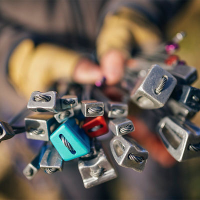A person holds out climbing nuts