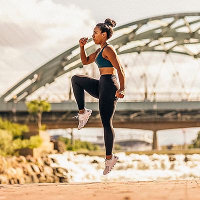 A girl warms up before a run