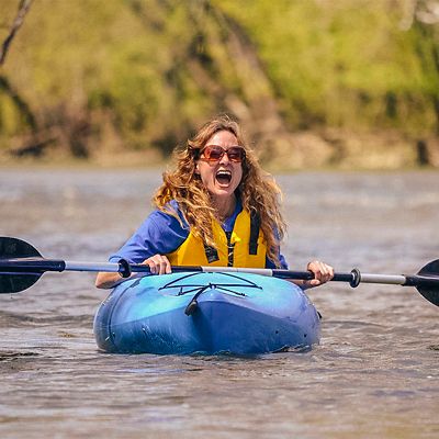 Lisa Daris kayaks on a river