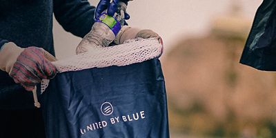 Volunteers pick up trash on the beach