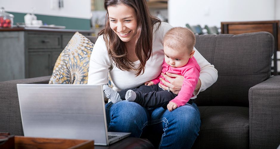 Mom shopping online with baby image
