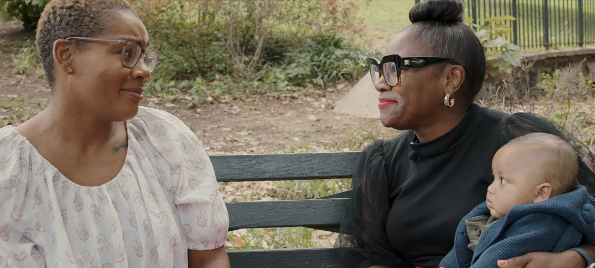 A mother and Kimberly Seals Allers with a baby.