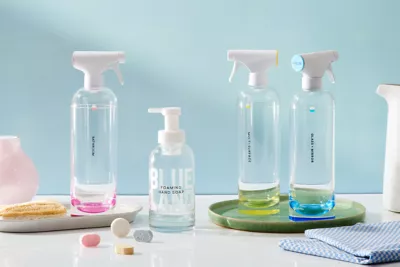 Blueland's reusable tritan and glass bottles for cleaning purposes to divert from single use plastics
