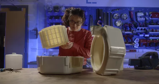Emily Tianshi in her garage lab working on her water-conservation project with Torrey Pine needles