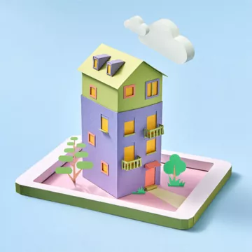 Colorful paper house with blue background to represent sustainable household goods. 