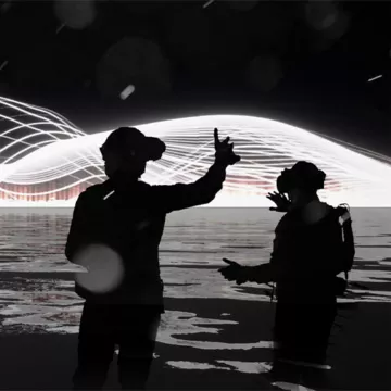 Individuals using virtual reality to experience orchestras in a show called Current Rising.