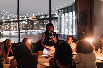 Dee Poku Spalding, founder of The Wie Suite, giving a speech at a dinner in Dumbo, Brooklyn, NY. 