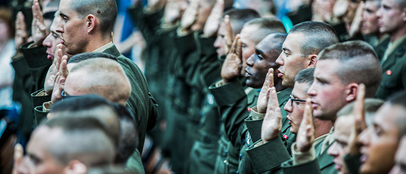 Officer candidates render first salute during commissioning ceremony marking completion of Officer Candidates School.