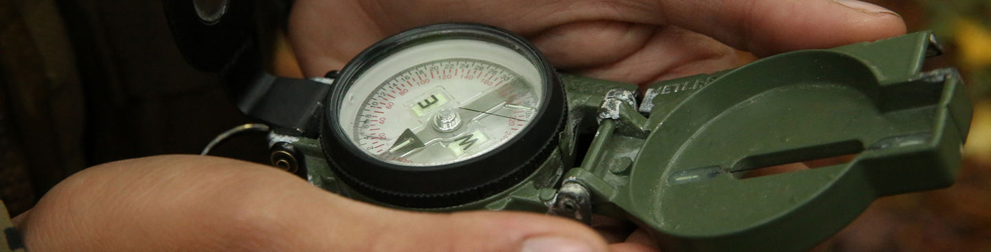 Pvt. Maximo Lieiano, a Marine with 4th platoon, Company I, Marine Combat Training Battalion, reads his lensatic compass during the MCT Land Navigation Course at Verona Loop aboard Marine Corps Base Camp Lejeune, Oct. 9. The Marines were split into teams of two or three to complete the course.