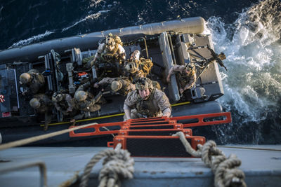 Marines climbing up the amphibious ladder.