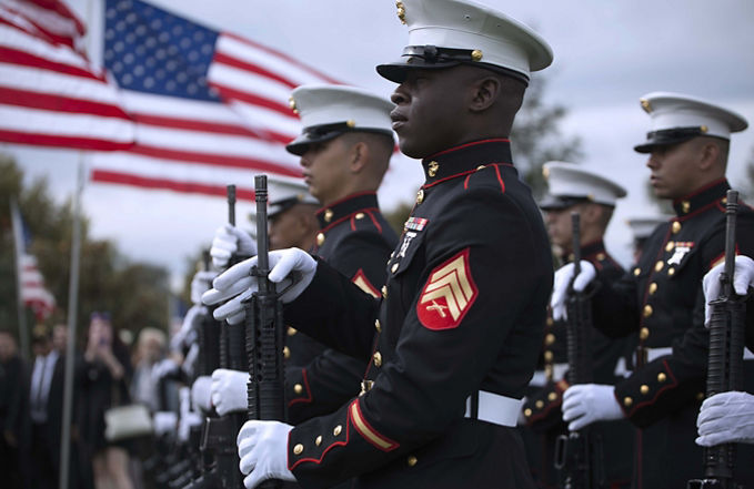 Marines in dress blues in formation.