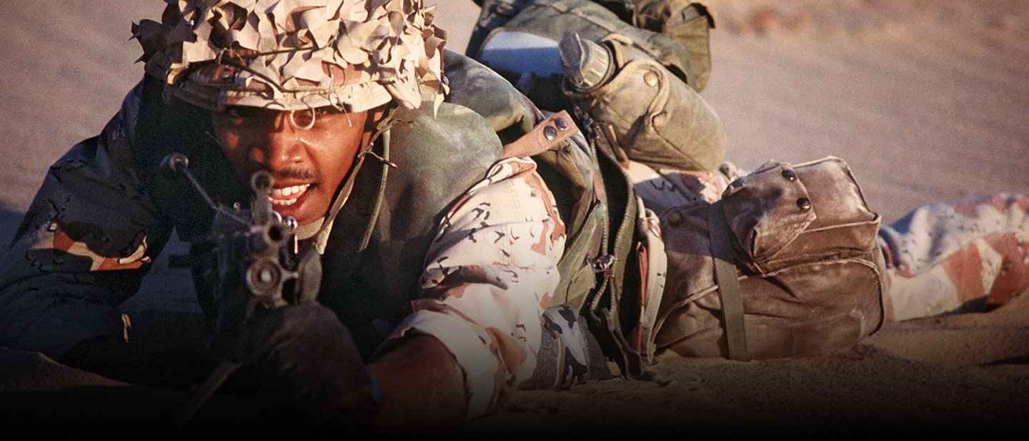 Marine with M249 squad automatic weapon in desert camouflage during Operation Desert Storm in Persian Gulf 1991.