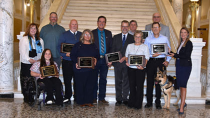 2025 Governor's Awards recipients pose for a group photo with South Dakota Governor Larry Rhoden and DHS Cabinet Secretary Shawnie Rechtenbaugh