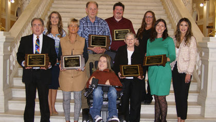 The 2022 Governor's Awards recipients posing for a photo with Governor Kristi Noem and DHS Cabinet Secretary Shawnie Rechtenbaugh.