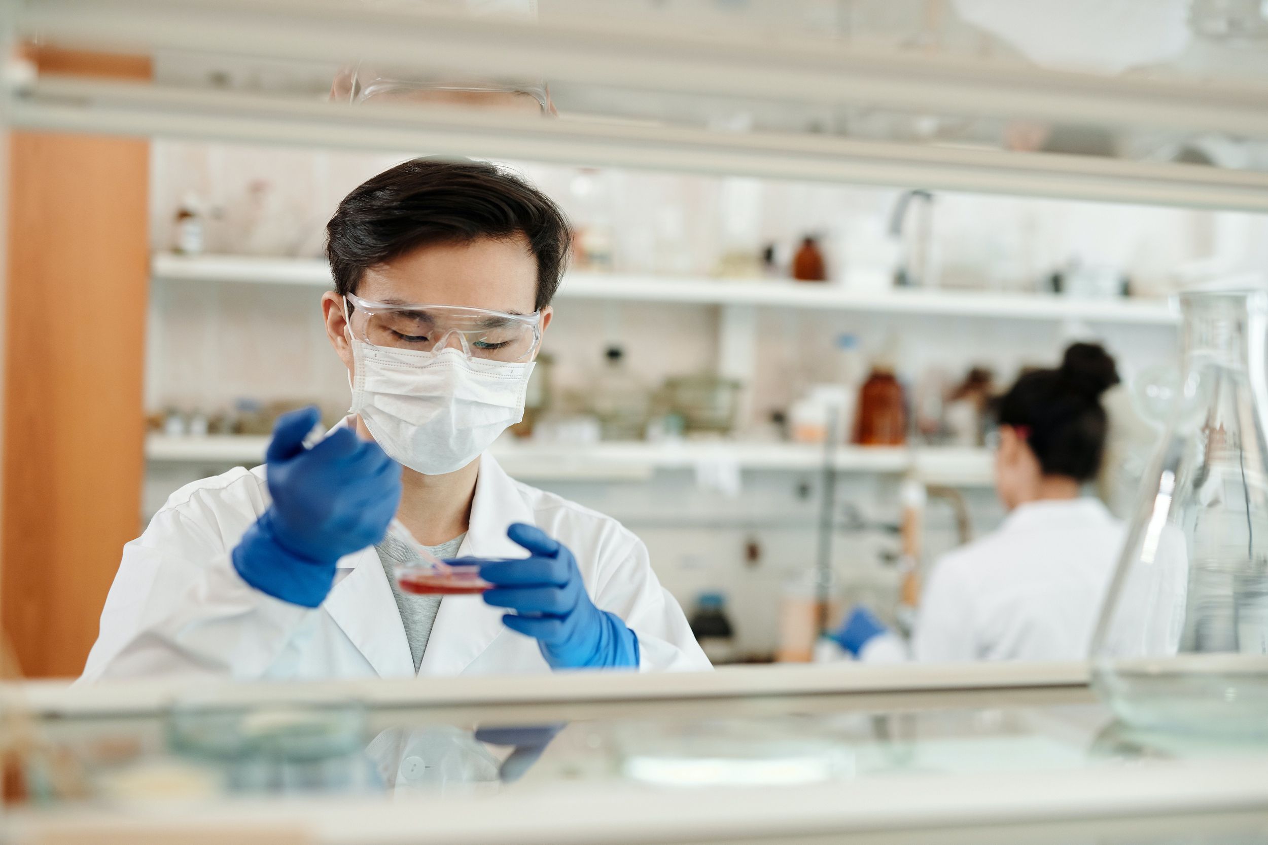 scientist extracting test material