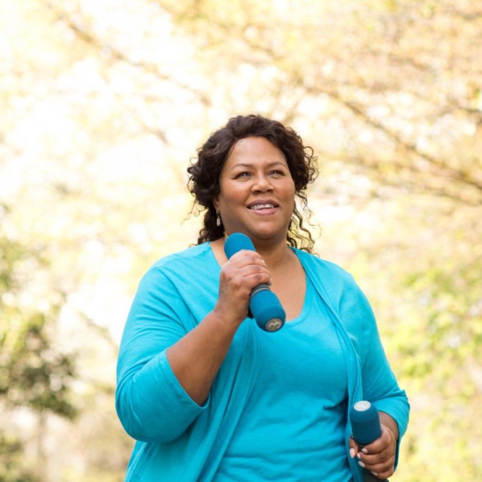 Woman jogging with weights