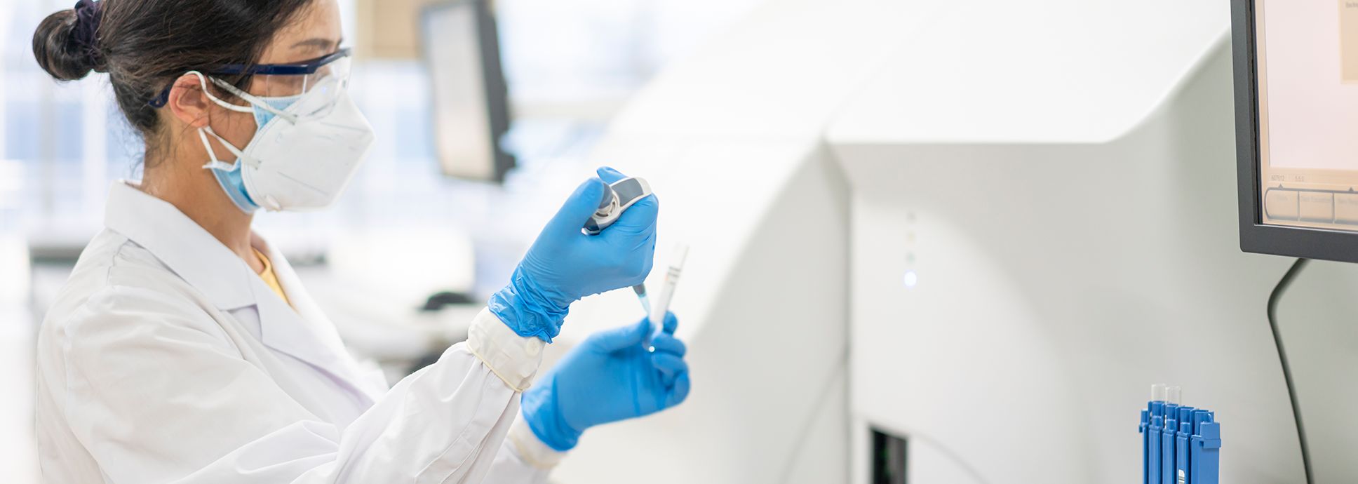 An image of a laboratory professional doing genetics testing