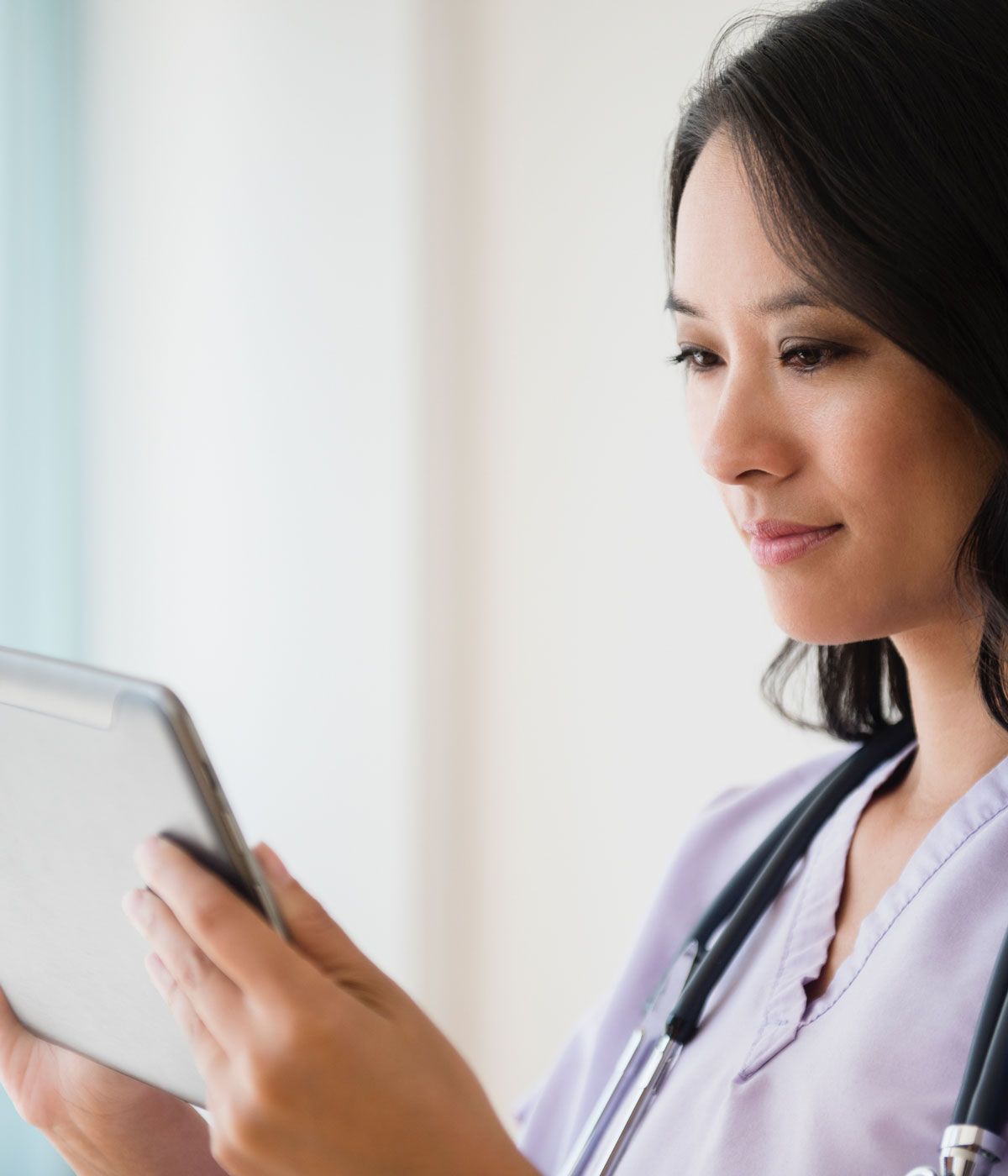asian female doctor on ipad