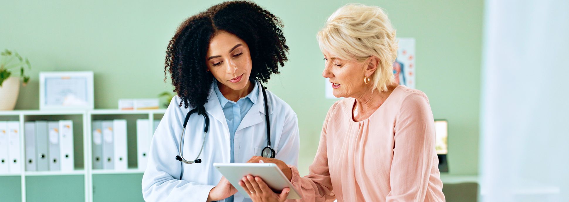 Woman with her doctor looking at test results