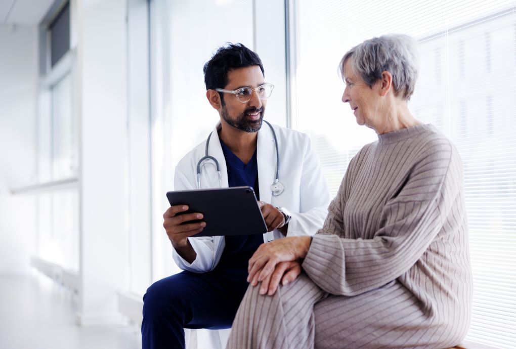 A doctor talking to a female patient about test results