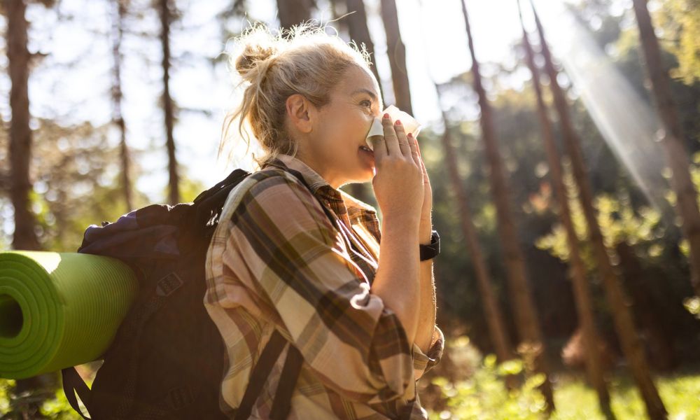 Woman blowing nose