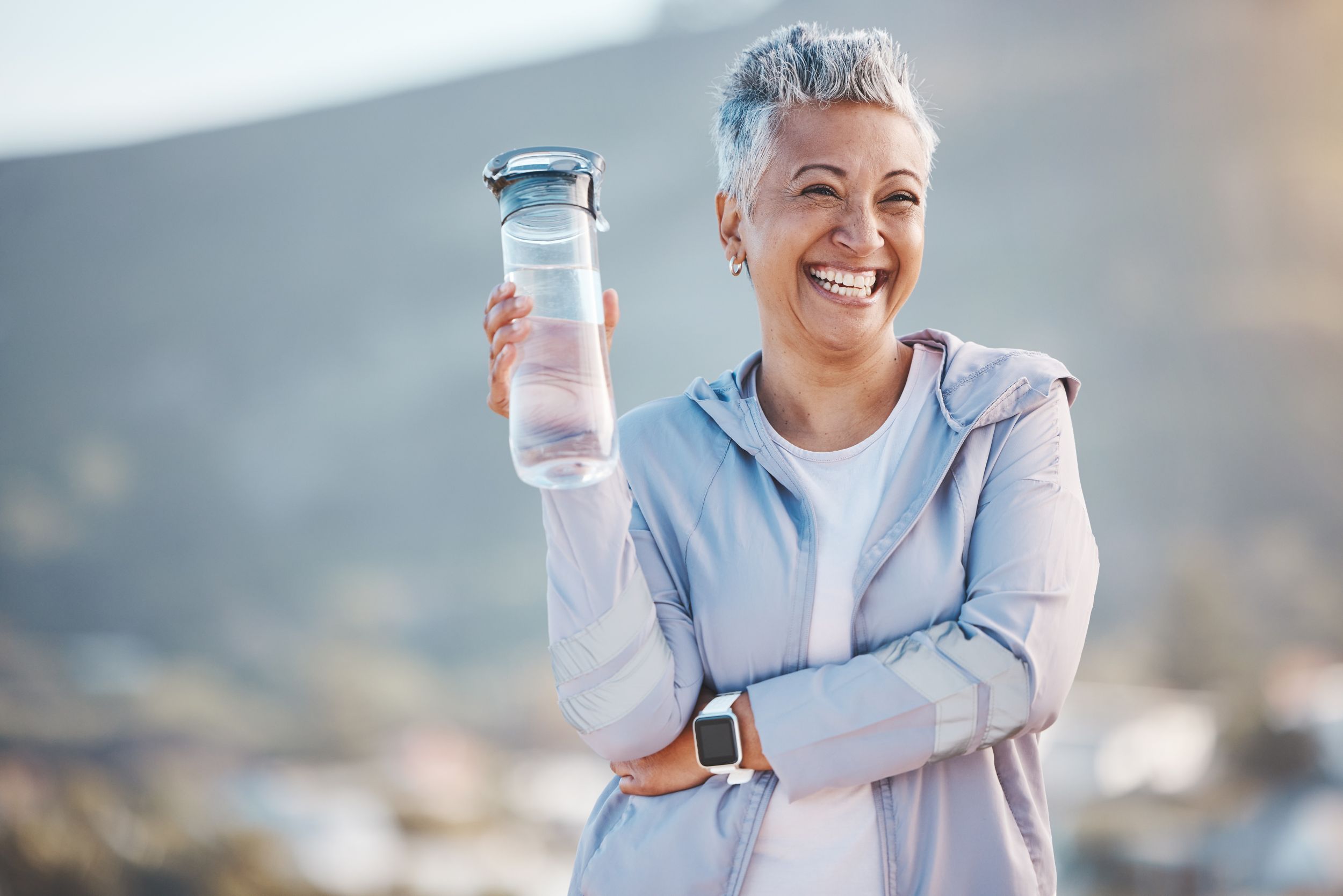 woman-with-water-bottle-AdobeStock_559076726