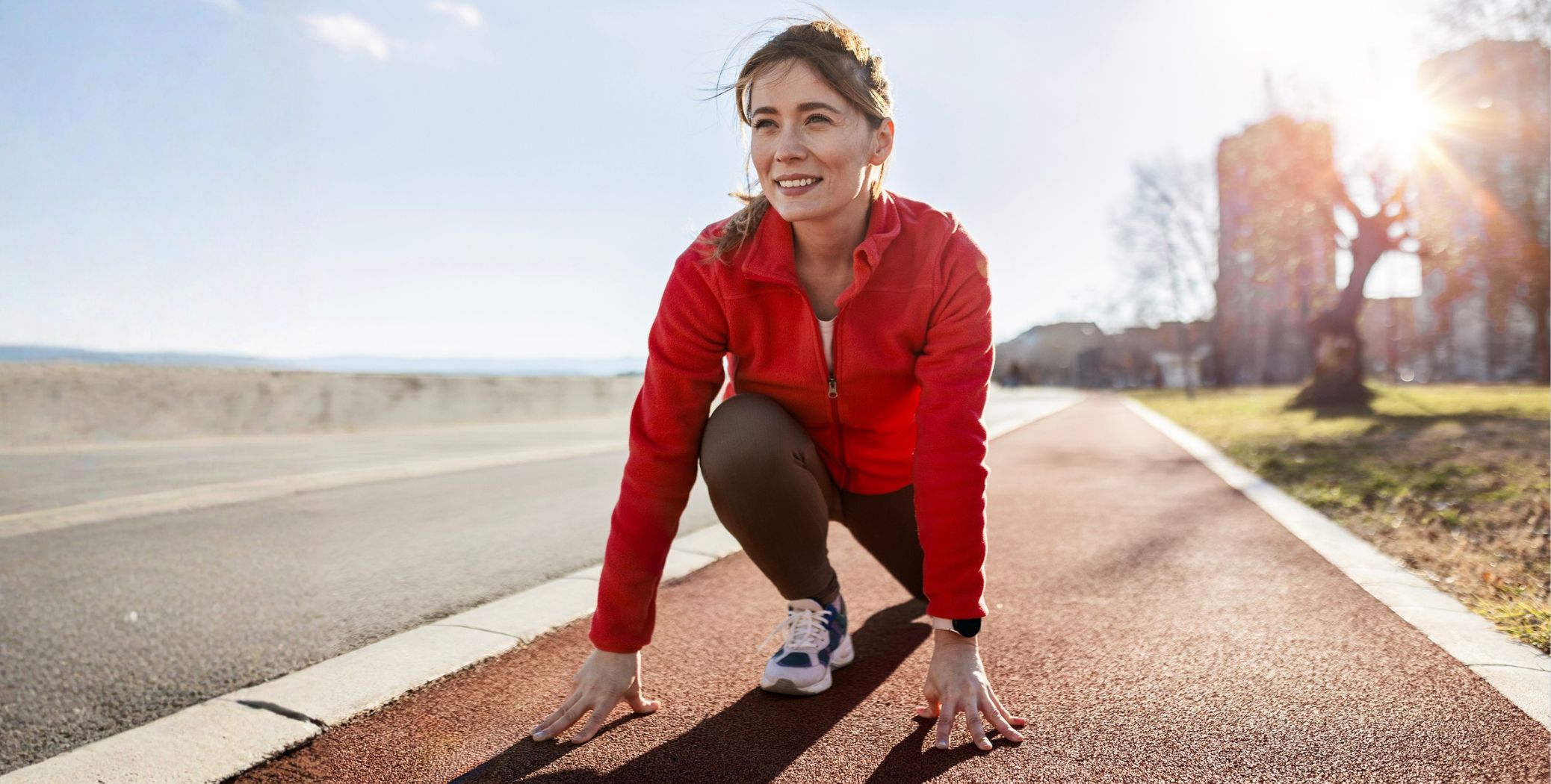 Woman running on track