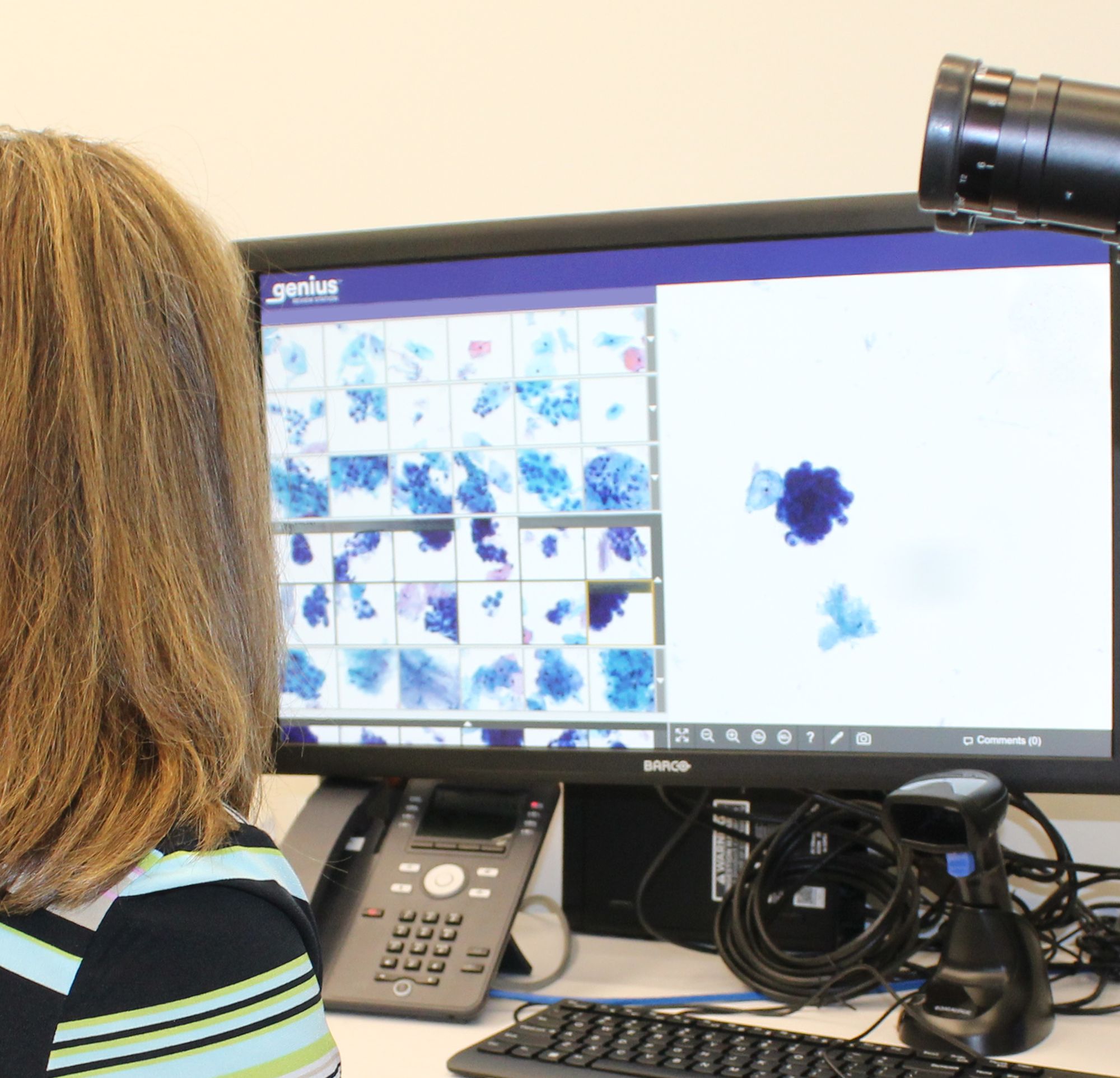 A Clifton Lab employee reviewing samples from Genius technology