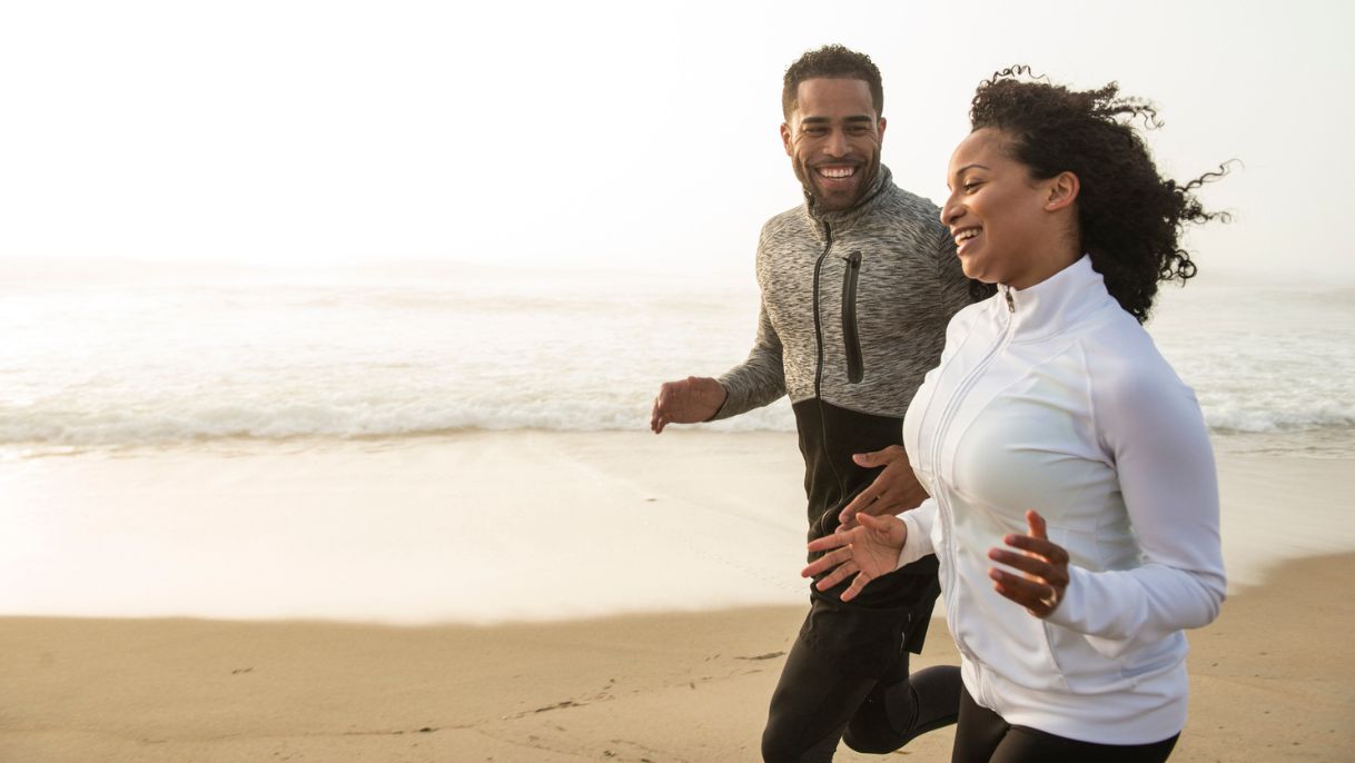 Couple running on a beach
