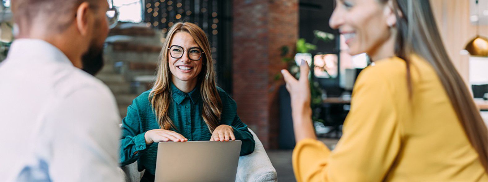 3 colleagues discussing benefits