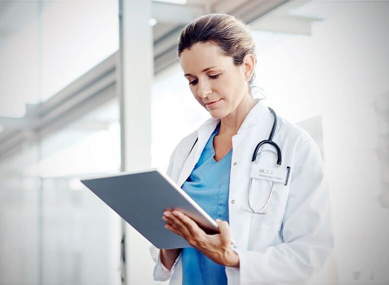 female doctor using tablet