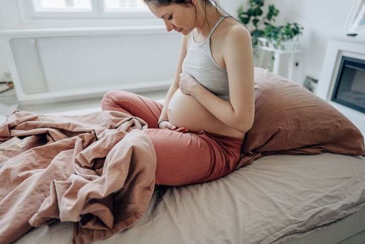 Pregnant woman looking down