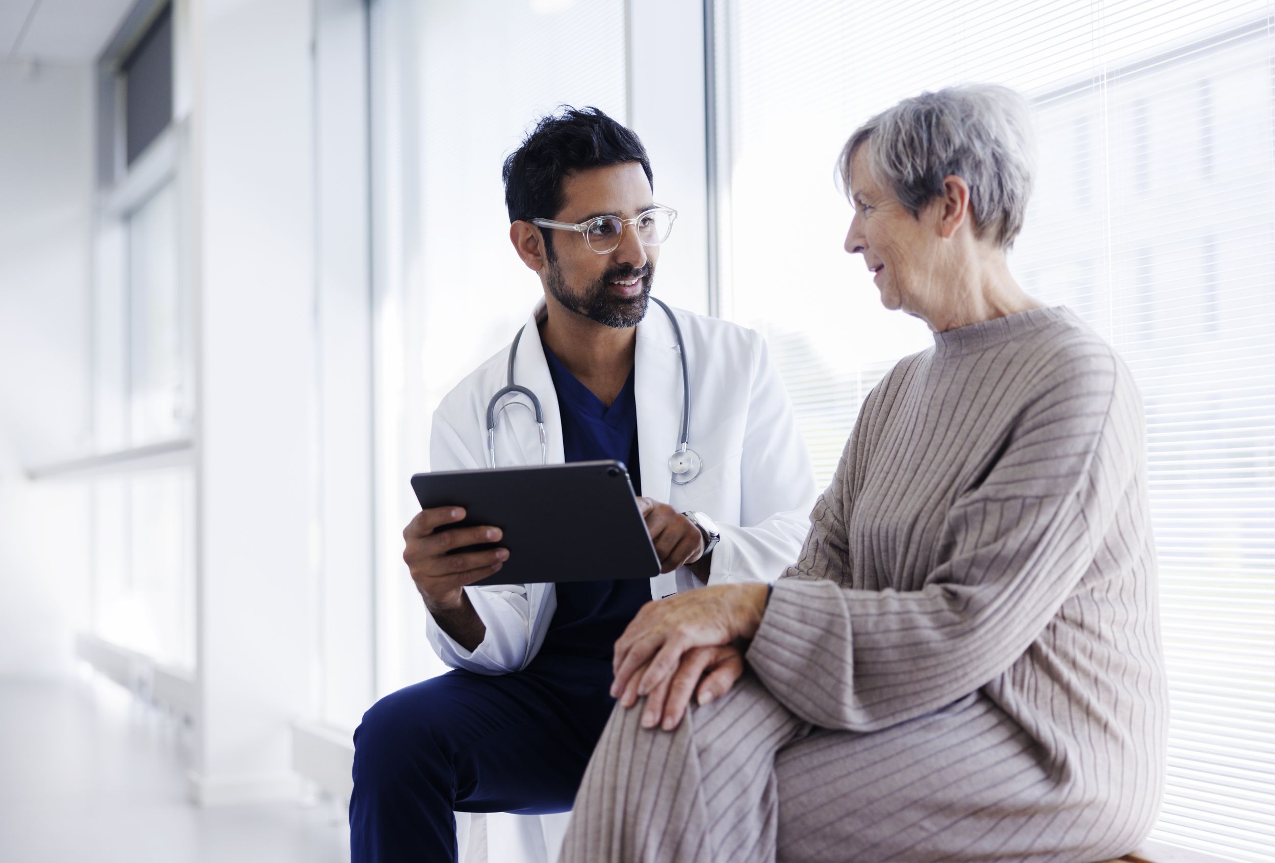 A doctor talking to a female patient about test results