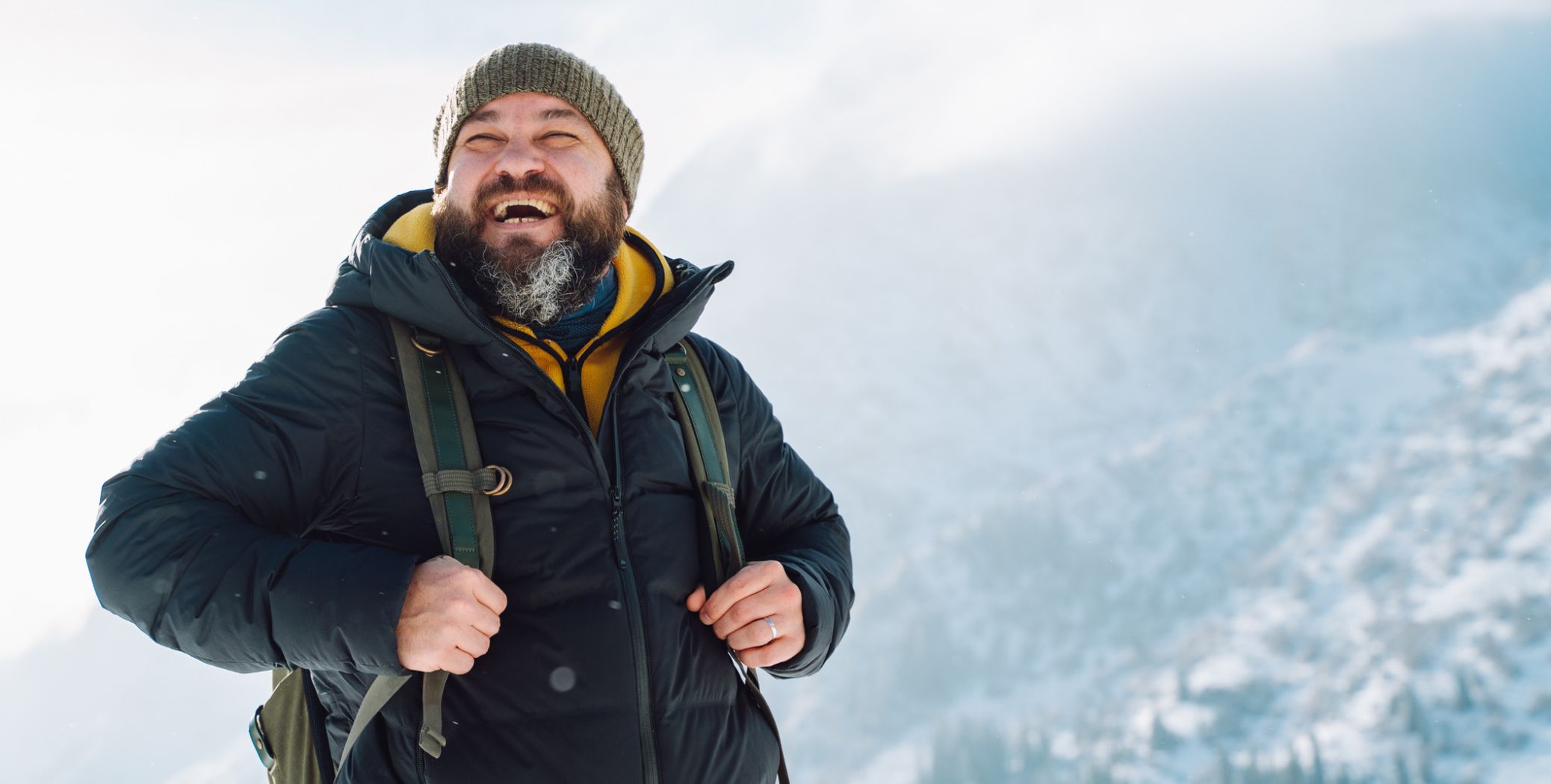 Man hiking a snowy mountain
