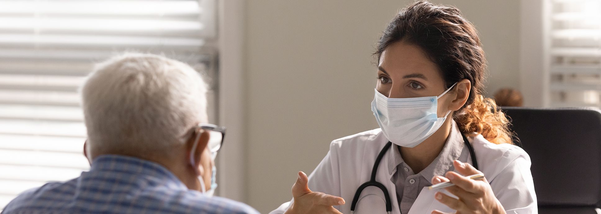 doctor and older patient consult