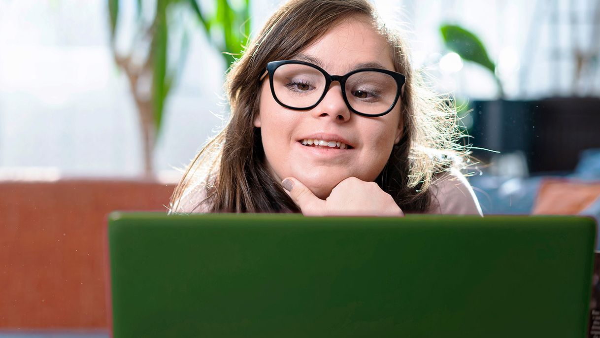 Woman looking at laptop